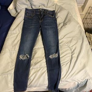 High wasted distressed blue jeans